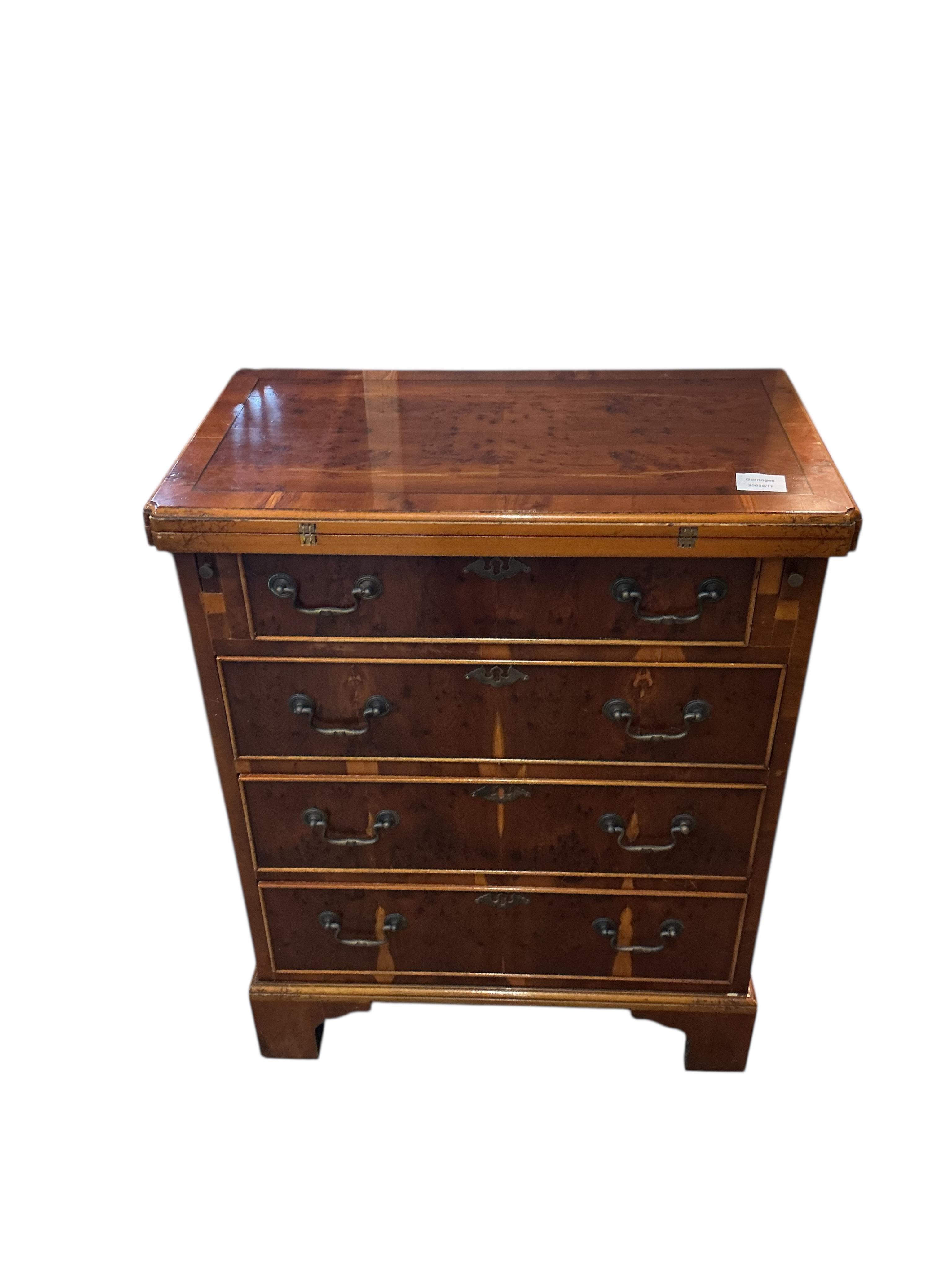 A small reproduction yew bachelor's chest, width 59cm, depth 34cm, height 76cm